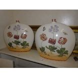 A pair of moon flask vases with floral a