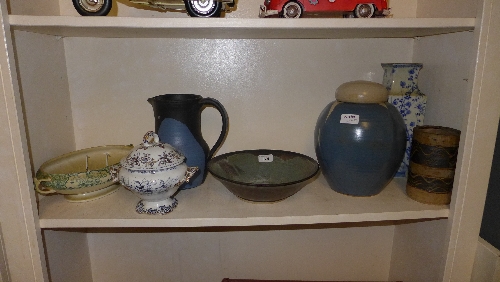 A collection of Studio pottery including Jim Galligan cylindrical vase and various others