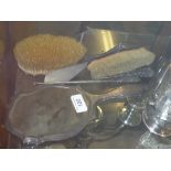 A hallmarked silver dressing set comprom