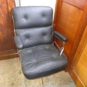 A Charles Eames style swivel desk chair