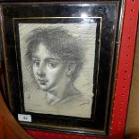 A charcoal portrait heightened in white within eglomised frame signed T.O'Donnell