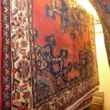 A fine North West Persian Tafresh rug 203 x 133 cm central floral medallion on a rouge field