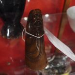 A Chinese Buffalo horn seal carved in the form of a sage