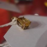 A Sri Lankan yellow sapphire approx five cts in a nine ct gold claw setting pendant