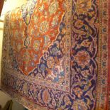 A fine central Persian Kashan rug 220 x 145 cm central pendant sapphire floral  medallion on rouge