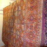 A fine North East Persian Turkoman carpet 315 x 168 cm repeating eagle Kazak motifs on a