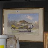 An early boxed toy model of a tiger moth plane and a watercolour of a biplane