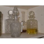 A collection of four decanters with two silver labels