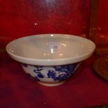A Chinese blue and white bowl decorated with dragons