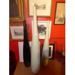 A set of three tall porcelain vases