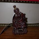 A Japanese carved seated figure