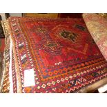 A fine South-West Persian Lori rug 210 cm x 127 cm repeating ghoul motifs on a terracotta field