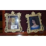 A pair of miniature prints portrait studies in carved painted frames