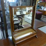 A late C19th mahogany swing mirror with base drawer