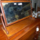A Victorian mahogany swing frame dressing mirror with bevelled plate