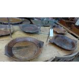 A collection of tribal teak food bowls