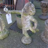 A reconstituted stone garden statue of a cherub Ht 70cm