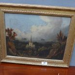 A C19th oil on canvas country landscape with cathedral in the fore in gilt frame