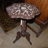 A Moroccan influence bone inlaid occasional table on tripod base