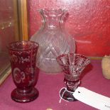 Two Bohemian ruby flash cut glass vases together with a bulbous crystal vase