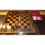 A Chinoiserie chess board and bone chess set