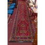 A fine North West Persian Tabriz runner, 455 x 91cm, repeating floral petal and vase motifs on a