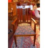 A pair of Art Nouveau mahogany chairs with drop in seats upholstered in floral fabric