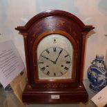 An Edwardian mahogany bracket clock with inlaid detail and Roman numerals to the dial, and a H.A.