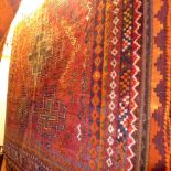 A fine South West persian Lori rug, 210 x 127cm, repeating goul motifs on a terracotta field