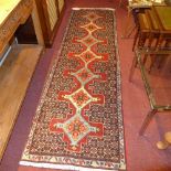 An extremely fine north west Persian Senneh runner, 255 x 75cm, repeating panel floral motifs