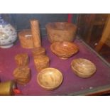 A collection of burr walnut items, including bowls, a pestle and mortar and lidded box