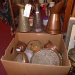 A collection of antique copper and brass items, including Arts and Crafts jugs, a planished tray and