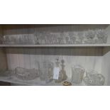 A large and varied collection of cut glass including decanters various drinking glasses and a basket