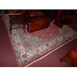 A Persian style rug the blue ground having all over floral decoration