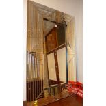 An Art Deco style wall mirror the rectangular plate within slatted bevelled multi border