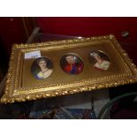 A set of three C19th portrait miniatures on porcelain within gilt and gesso frame