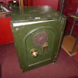 A green painted S. Withers safe (open but no key)