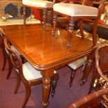A Victorian mahogany extending dining table with one extra leaf and winding handle raised on heavy