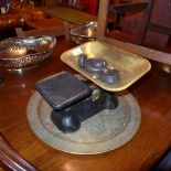 A set of grocers scales and an engraved Eastern brass tray
