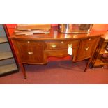 A C19th inlaid mahogany bow fronted sideboard fitted arrangement of drawers with brass handles on