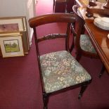 An early C19th set of three rosewood dining chairs with tapestry upholstered drop in seats