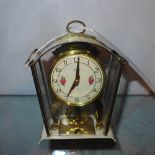 A German Schatz 8 day movement clock with hand painted decoration
