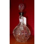 A Victorian cut glass decanter with hallmarked silver collar
