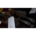 A Georgian silver basting spoon together with a silver plated example