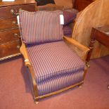 A pair of C19th Bergere chairs with cushion seats and caned sides on cabriole supports