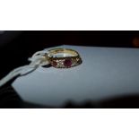 A 18ct gold ladies ring inset with ruby and diamonds