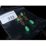 A pair of 14ct gold and green semi precious stone droplet form earrings
