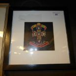 A signed Guns and Roses framed album cover