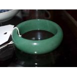 A Chinese green jade bangle