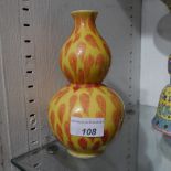 A Chinese yellow and orange glaze double gourd vase